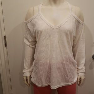 White long sleeve cold shoulder top. .